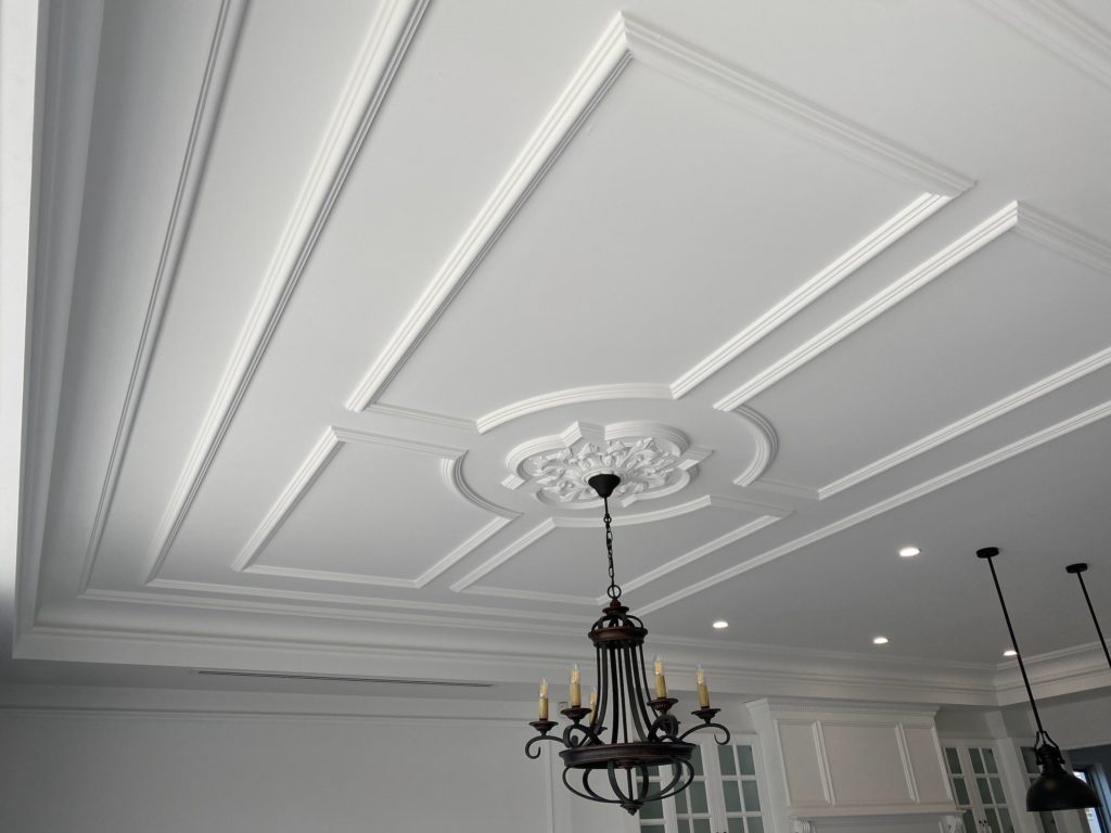 Decorative ceiling rose and moulding detail