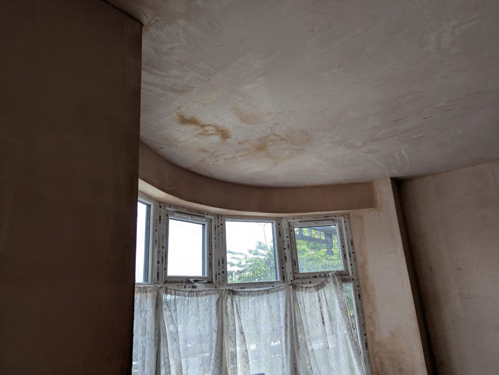 Newly plastered wall before cornice installation