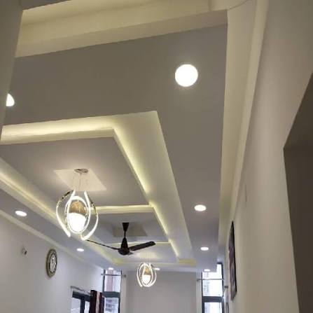 LED lighting mouldings creating indirect ceiling illumination in a modern interior